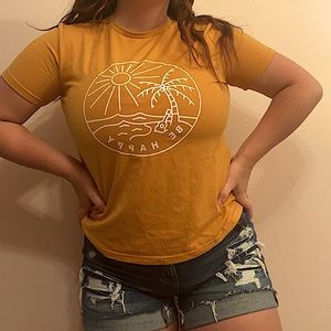 Orange shirt from shein with “Be Happy” lettering